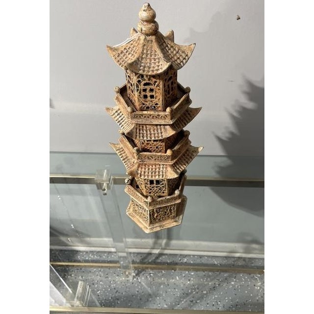 Inspired by ancient Chinese wooden watchtowers and features four detailed hexagonal sections, three graceful roofs, and...