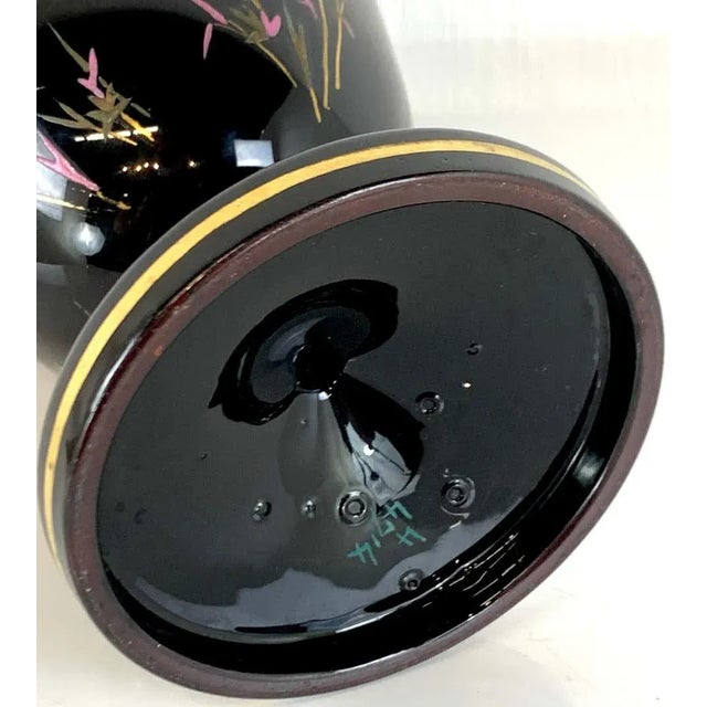 Pair of French Aesthetic movement enameled bird motif black & gold vases, each one with twin applied handles, colorful...