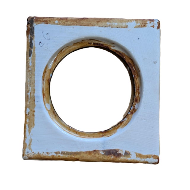 This antique blue and white porcelain mirror or frame is a decorative collectible item that exudes elegance and charm. The...