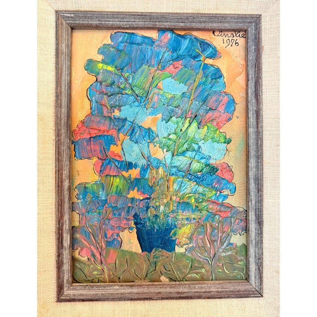 This vibrant acrylic painting by artist Ainslie captures the essence of abstract trees in full color. Framed in a rustic,...
