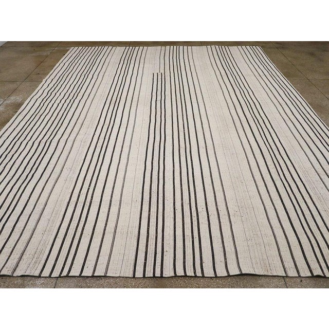 A vintage Turkish flatweave Kilim large room size carpet handmade during the Mid-20th Century. Measures: 12' 2" x 15' 0".