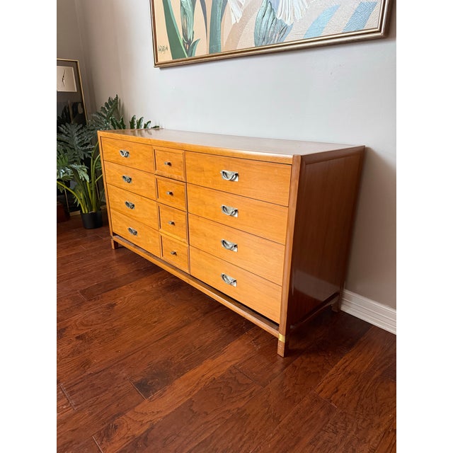 Gorgeous and well designed 12 drawer dresser by "Tung Si," known for being manufactured by Hickory Manufacturing Company....