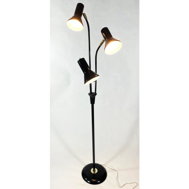 Gerald Thurston Triennale floor lamp for Lightolier. Original white enameled frame and base with brass detailing. 64"...