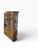 Elegant vintage china cabinet by Thomasville featuring a warm oak finish, architectural detailing, and a gracefully...