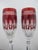 Pair of Waterford Crystal Clarendon champagne flutes in Ruby Red tone. Elegant stemware in vibrant ruby red tone cut-to-...