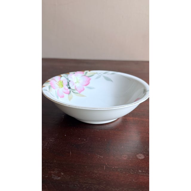 Early 20th century Noritake porcelain dessert bowls, hand-painted in the Azalea pattern with pink flowers and gold trim....