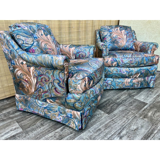 A Pair of Vintage Mid Century / Hollywood Regency Upholstered Lounge Chairs. Circa 1970s Features the original Paisley...