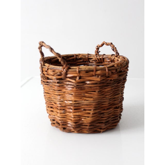 Vintage Handwoven Wicker Basket With Twisted Handles For Sale - Image 10 of 11