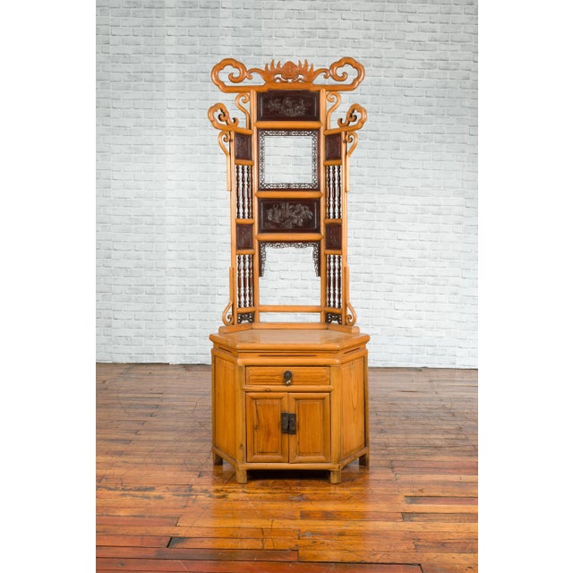 A Chinese Qing Dynasty period bamboo washstand from the 19th century, with carved and lacquered panels. Created in China...