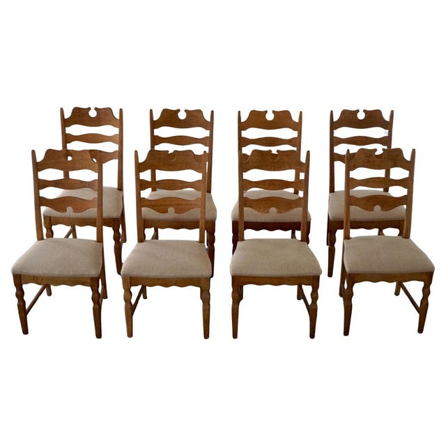 A sculptural and highly recognizable set of eight high-back “razorblade” dining chairs crafted in solid oak. Designed by...