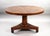 A striking Regency period flame mahogany breakfast table, circa 1820, featuring a superb circular top veneered in richly...