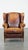 Characteristic and timeless vintage sheep leather wing chair with beautiful colors and good seating comfort. A true eye-...