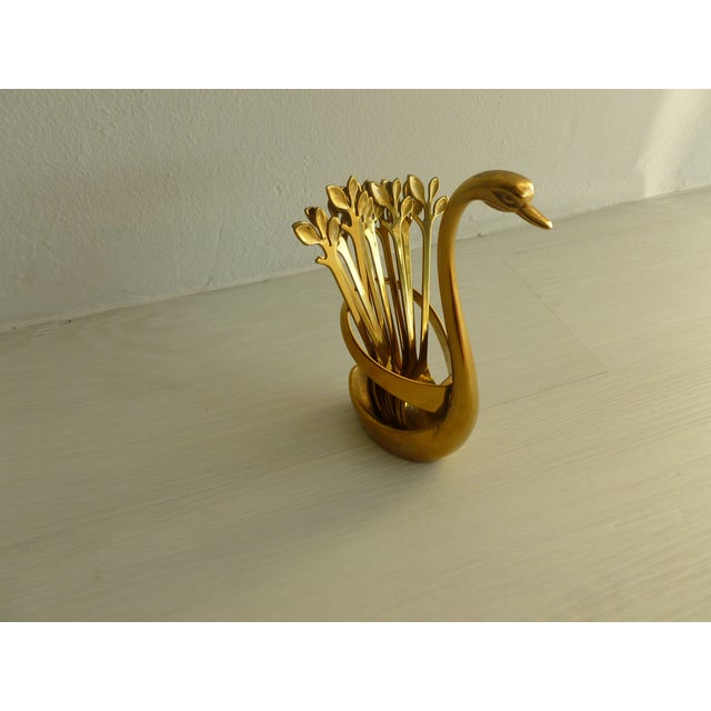 This charming vintage brass swan vessel container has 10 original serving spoons for your entertaining needs. From the...