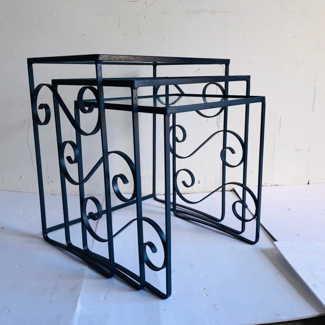 Mid-Century style nesting tables; new glass and new nautical blue paint. Large 18.5"L X 12.5"D X 20.5"H Mid 16.5" L X...