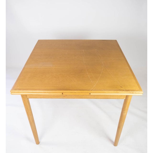 Dining table in oak with extensions, of danish design from the 1960s. The table is in great vintage condition....