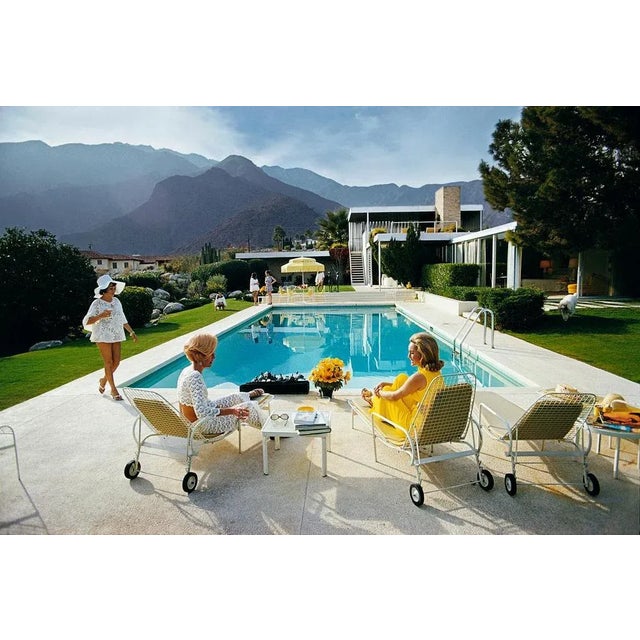 Catch Up By The Pool 1970 by Slim Aarons Slim Aarons Limited Estate Edition Former fashion model Helen Dzo Dzo Kaptur (in...