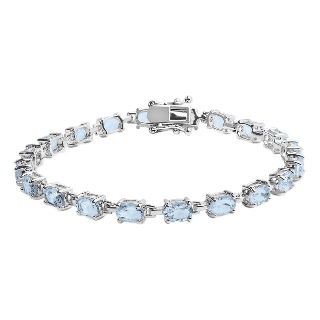 .925 Sterling Silver 11.0 Cttw Oval Shaped Created Light Blue Topaz Link Bracelet - 7 inch For Sale