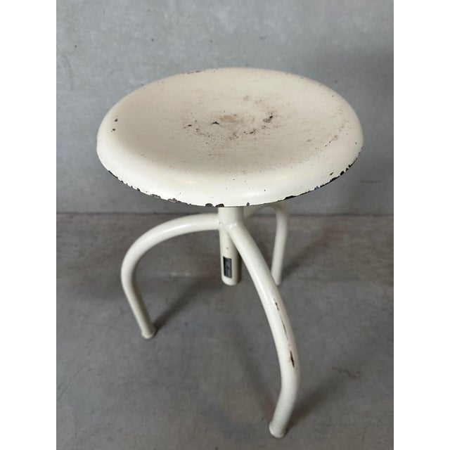 Very solid adjustable metal vintage stool from ManuBelge. Both the tripod and the seat are metal. These stools were mainly...