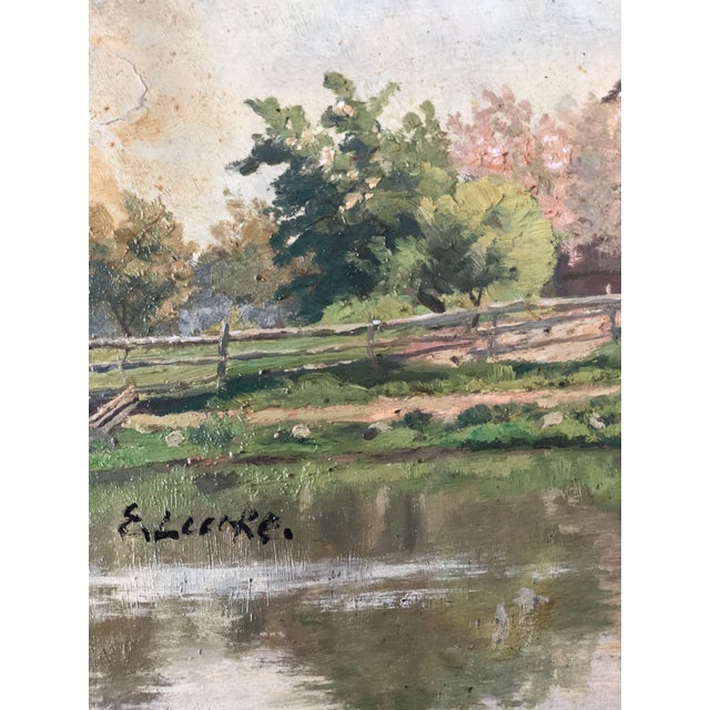 An antique original oil painting of a countryside cottage landscape, dating from around 1925. The painting shows a...