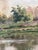 An antique original oil painting of a countryside cottage landscape, dating from around 1925. The painting shows a...
