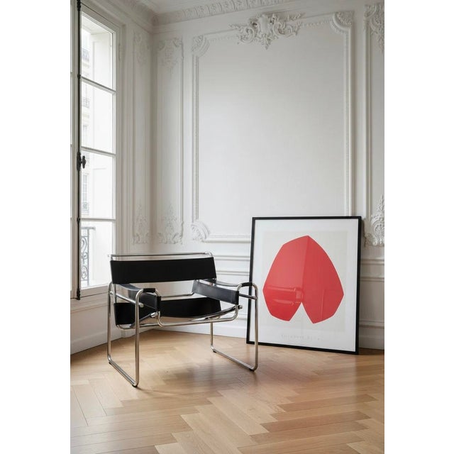 Experience the timeless elegance of Ellsworth Kelly's "Red White" (1962), a striking screen print that exemplifies the...