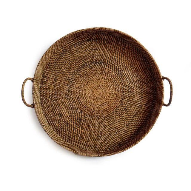 Hand woven tea stain rattan round tray with handles. Each slightly unique in natural material differences and handmade...