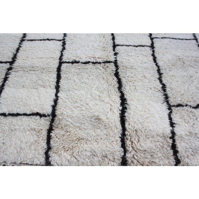 One-of-a-kind hand-knotted Moroccan rug in soft, organic wool with an elegant harlequin brick pattern. This gorgeous rug...