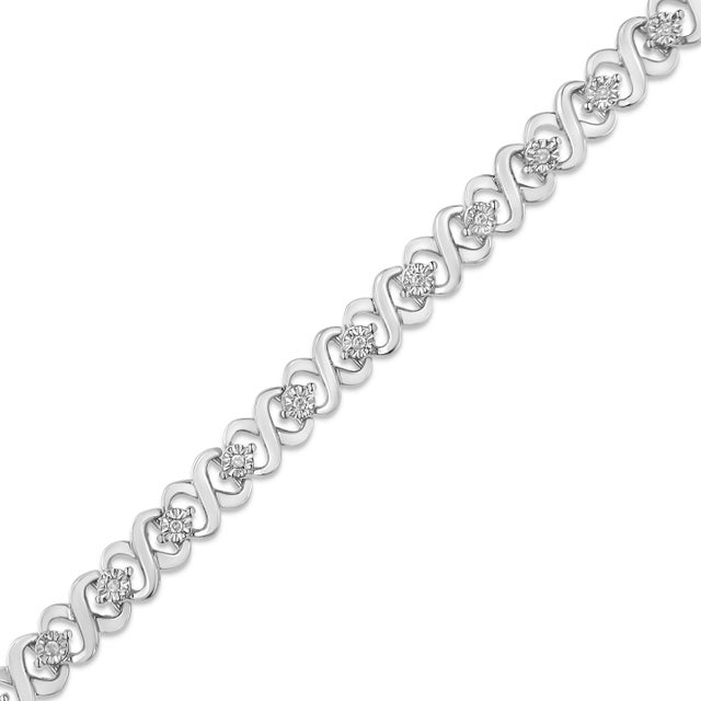 You will love this elegant and timeless classic tennis bracelet with a unique alternating pattern of silver x-links and...