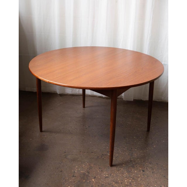 A Danish teak dining table produced in the 1960s in the manner of Grete Jalk — sharing the restrained, practical...