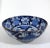 A vintage porcelain bowl with white blossoms against an ultramarine blue glaze. Purchased in Korea in the 1960s, and dated...