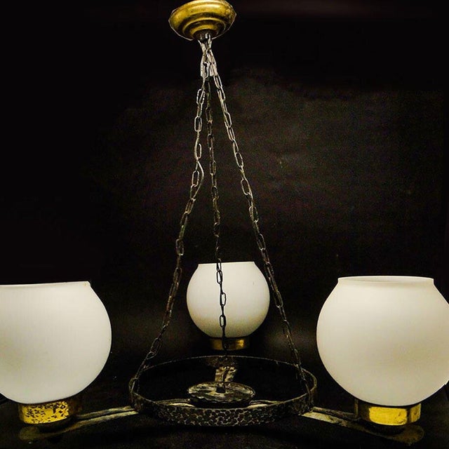 This pendant lamp was manufactured in Poland in the 1970s. It is designed in the Art Deco style and is in good condition....