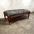 A mid 20th century Colonial Revival bench brought into a rich, English-country mood with designer upholstery. The frame...