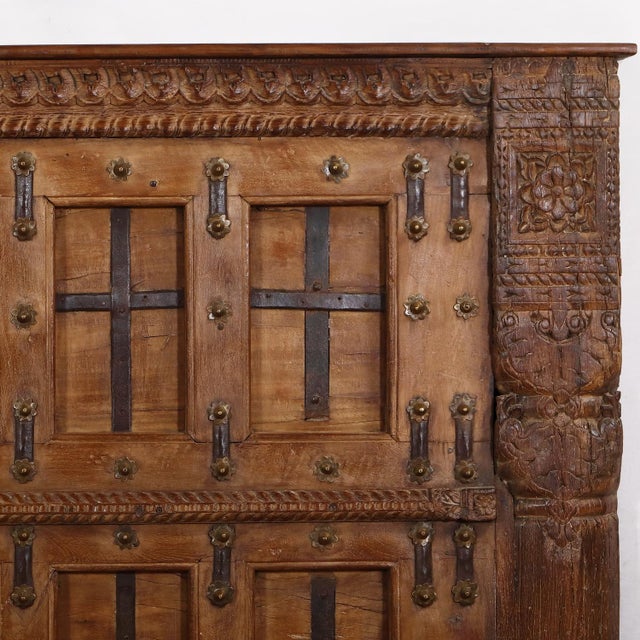 Crafted from an antique Indian teakwood door with slim iron strap detail, this king-size headboard brings the artistry of...