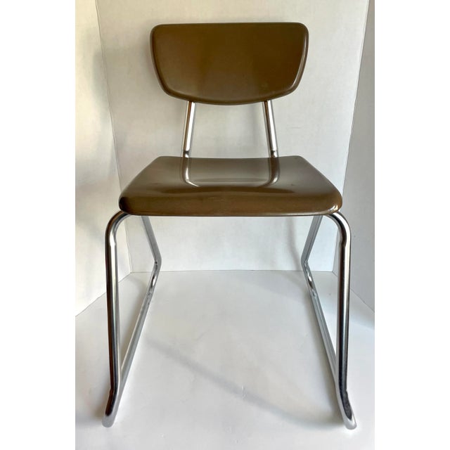 Here is a fantastic set of TWO school chairs made by Virco in the mid-century. The chairs feature a lovely chrome base...