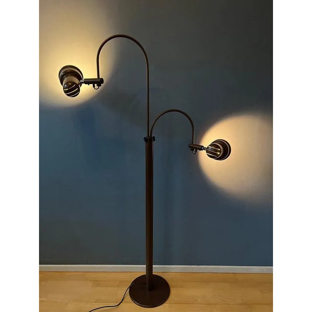 Highly flexible mid century gepo space age floor lamp with two arms and adjustable shades. The two cones can be turned in...