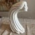 An eye-catching and evocative vintage ceramic sculpture depicting a stylized woman's face with long, flowing hair. This...