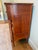Beautiful Empire-style solid cherry wood chest of drawers featuring turned legs, wood pulls, and dovetail joints. Nice...