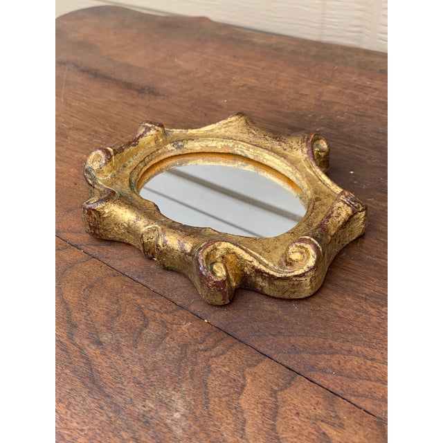 A stunning Italian Florentine baroque rococo style wall mirror Italy, Circa 1960s Gold gilt wood, with mirror. Measures:...