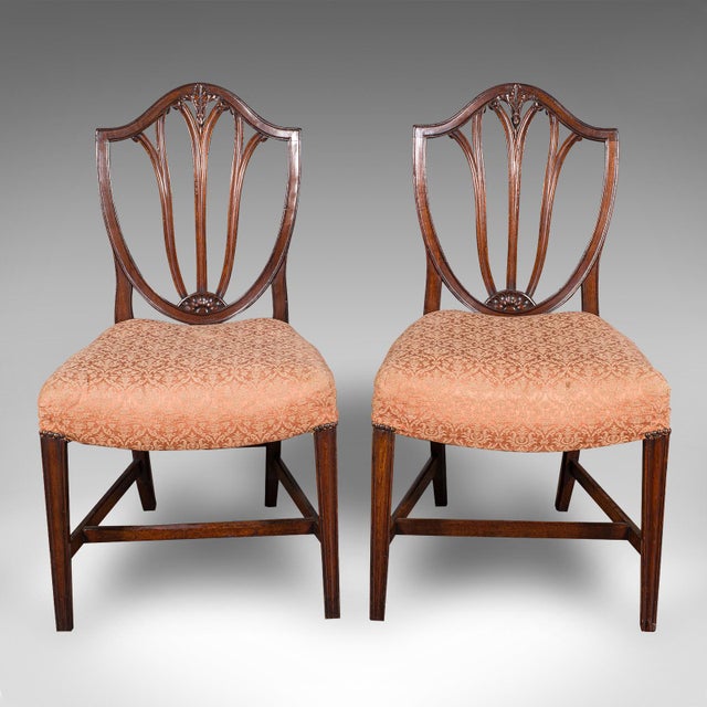 This is a pair of antique Hepplewhite taste side chairs. An English, fruitwood decorative hall seats, dating to the...