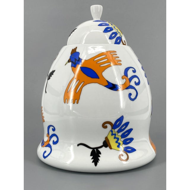 A lidded box is for sale. *lidded box / urn vase with lid *painted with a cheerful, colorful pattern by nathalie du...