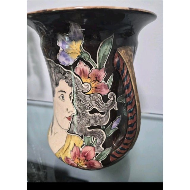 This vase was made between 1897 and 1905 by the Franz Anton Mehlem factory in Bonn, Germany.