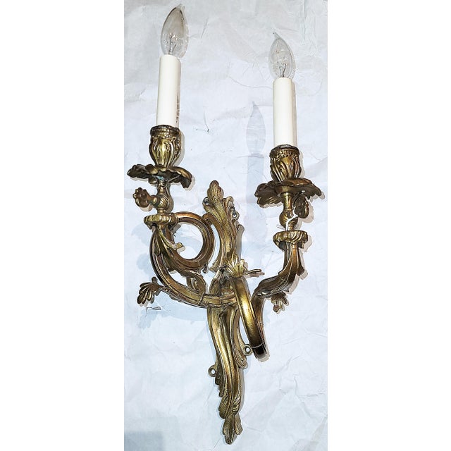 Twists and turns of the best of French rococo and Louis XV style in this gold plated bronze gaslight-era wall sconce from...