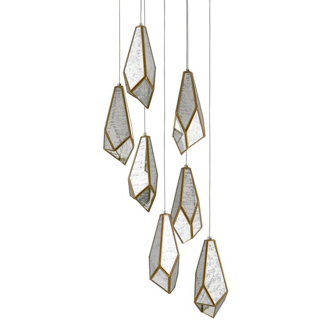The faceted shades of the Glace 7-Light Multi-Drop Pendant are made of panes of Raj mirror joined with seams of metal in a...