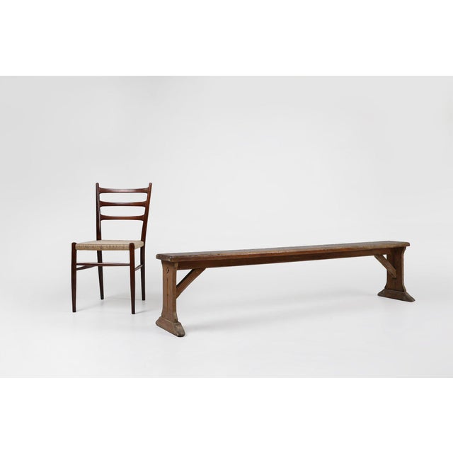 A beautifully worn French oak bench dating to around 1850, combining the authenticity of rural craftsmanship with a...