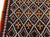 Vintage Moroccan Rug Size: 5'6" × 7'6" (167 × 228 cm) This vintage Moroccan rug features a striking geometric pattern set...