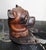 Victorian-era desk accessory, specifically a bulldog-shaped inkwell, crafted from carved wood with inset glass...