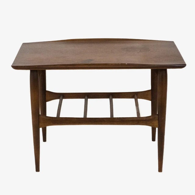 Mid-Century Modern walnut coffee table by Bassett Furniture Company, circa 1965. Surfboard style table with distinctive...