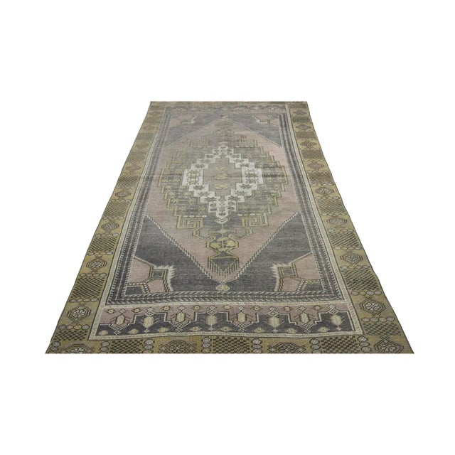 Vintage handknotted worn out area rug from Konya region of Turkey. Approximately 50-60 years old. In very good condition