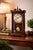 A beautifully composed vintage wall clock featuring a classic 31-day key-wound mechanical movement housed in a richly...