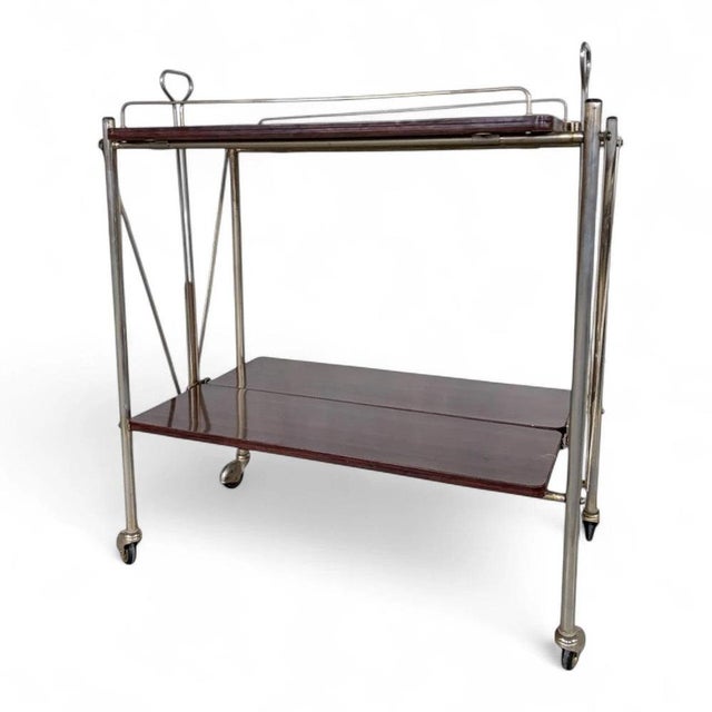 This mid century bar cart offers a perfect blend of style and function for your entertaining needs. Crafted with rich...